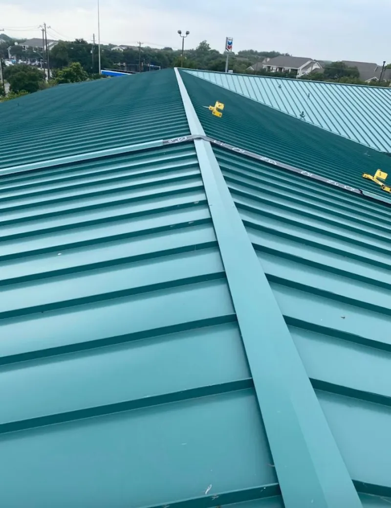 Green commercial metal roof ridge and valley for Metal Roof Repair in Millburn